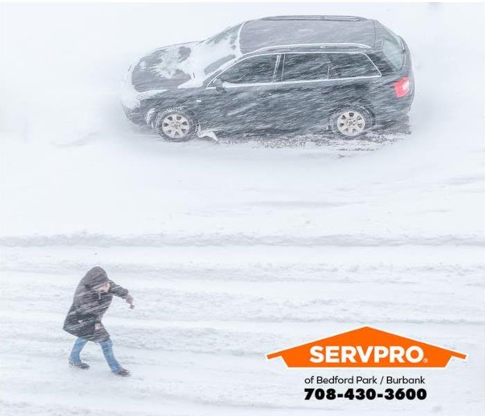 A snowstorm limits visibility.